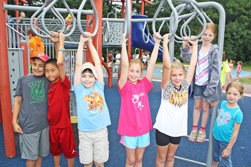 YOUNGSTERS, from left, Alex Baldini, Jason McCausland, Michael Savio, Madison McCarthy, Elli Graves, Mia O’Brien and Zoey O’Brien, had a blast hanging out at Summer Street School’s playground during Recreation Station on July 10. (Dan Tomasello Photo) 