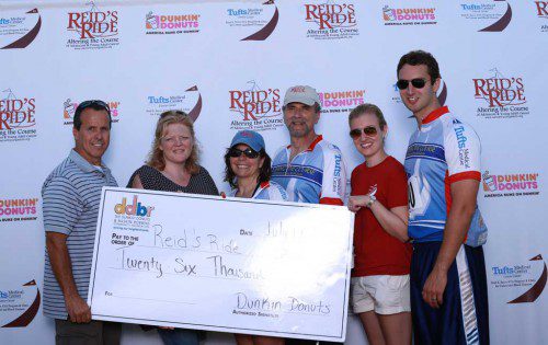 DUNKIN' DONUTS, the premier event sponsor of the 11th annual Reid's Ride, presented a check for $26,000 to the Reid Sacco AYA Cancer Fund. From left: Regional Vice President of Dunkin' Donuts Northeast Bill Bode, Operations Manager Jen Bonugli and Reid's Ride Directors Lorraine and Gene Sacco and Drs. Lindsay and Weston Sacco. The event raised $190,000. (Courtesy Photo)
