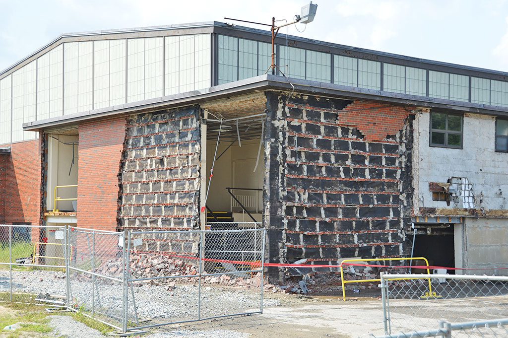 DEMOLITION of the old North Reading High School started on Tuesday, with most of the work expected to be over in a couple of weeks. (Bob Turosz Photo)
