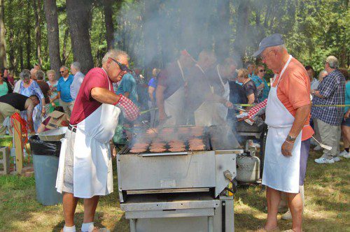 THE ELKS CLUB held its 39th annual cookout for area senior citizens over the weekend, cooking up dozens of burgers and dogs for those who attended the event, held behind the club’s Bay State Road building. A great time was had by all. (Francis Hegarty Photo)