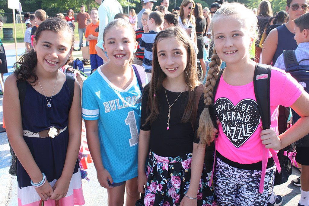 FOURTH GRADERS, from left, Kiera Doherty, Gianna D’Ambrosio, Siena Furfaro and Lilly Collins were all smiles on the first day of school at Huckleberry Hill on Tuesday, Sept. 1. (Dan Tomasello Photo)