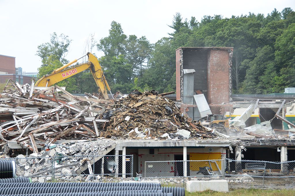 THE CLOCK FINALLY EXPIRED on the old high school gymnasium, which wrecking crews reduced to a pile of rubble on Tuesday. It didn’t take long to actually demolish the old gym, but the memories that lived there  will last for decades. (Bob Turosz Photo)