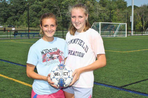 SENIOR CAPTAINS Alexis Yannone (left) and Abbie Weaver will be leading the girls’ soccer team on the field this fall. Missing from photo is senior captain Kelly Look. Look, who will miss the 2015 Division 3 season with a torn ACL, will be leading and cheering the Pioneers on from the sidelines. (Dan Tomasello Photo)