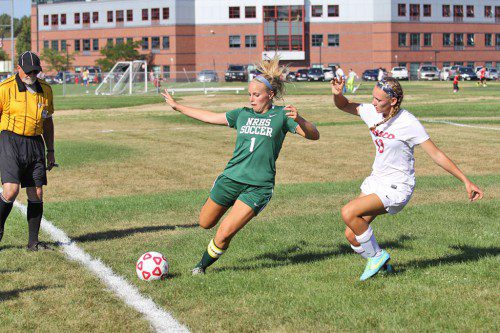 SENIOR KATIE WELCH clears the ball from her Masco opponent at the girls varsity soccer team opened their season against the Chieftains last week. Masco won the hard fought contest, 1–0. (Steve Nathan Photo)