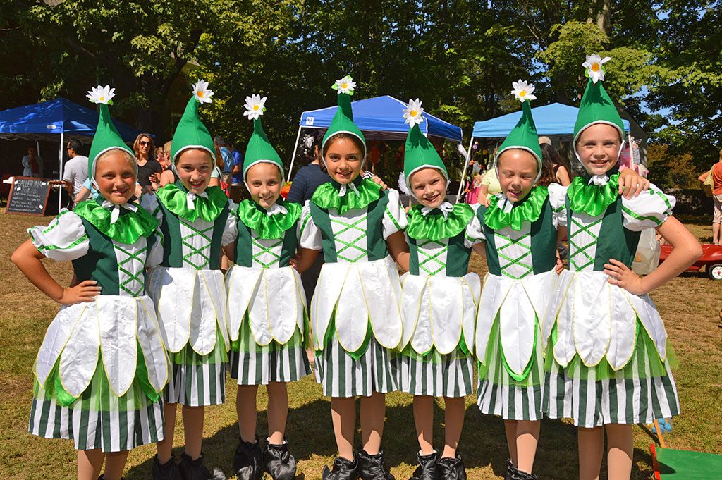 MUNCHKIN DANCERS from the North Reading School of Ballet performed to music from the Wizard of Oz at Saturday's Apple Festival. From left: Annie Kuperstein, Ava Mericantante, Jillian Chinchillo, Mia Benecke, Elisabeth Quirbach, Madison Vant and Lucy Wagner. (Bob Turosz Photo)