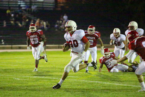 SENIOR QB Julian Nyland ran for 2 touchdowns last Friday night in Melrose's 37-10 win over Waltham. Melrose hosts Burlington tonight at 7:00 p.m. at Fred Green Field. (Donna Larsson photo) 