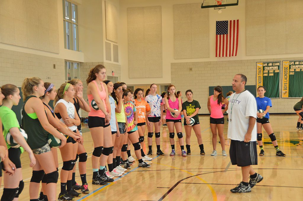 HEAD COACH MIKE MILONE discusses strategy with the volleyball team, which returned to the NRHS gym for practices this week. (Bob Turosz Photo)