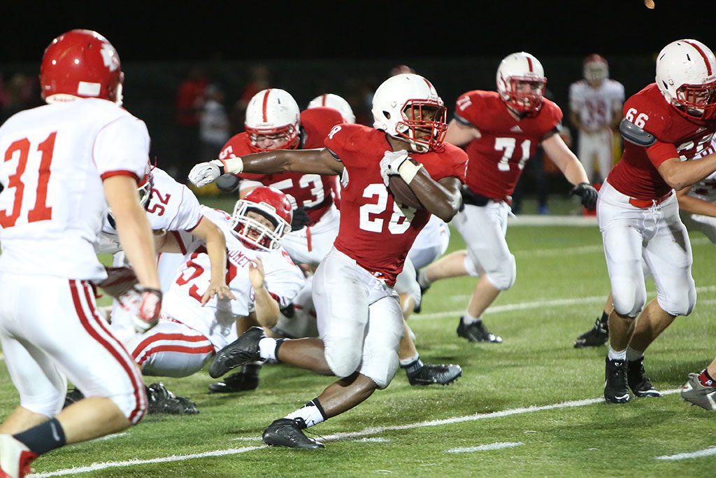 JAY TYLER ran for over 100 yard with 2 touchdowns to help Melrose Red Raider football improve to 30 with a 21-7 win over Burlington. (Donna Larsson photo)