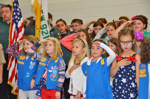 LOCAL BROWNIES, Girl Scouts and Camp Fire Girls lead the audience in the Pledge of Allegiance at Veterans Day ceremonies. See Veterans Day coverage inside. (Bob Turosz Photo)
