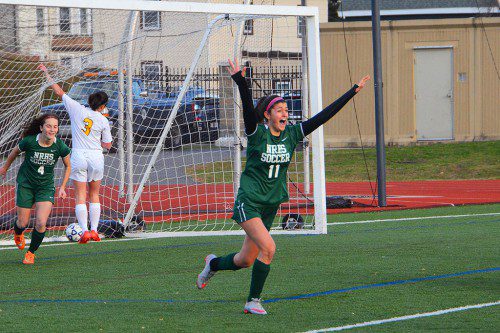 THE GAME WINNER. Junior Haley Nathan (11) celebrates her goal that put North Reading ahead to stay, 2-1. Number 4 for Hornets is  sophomore Meredith Griffin. (John Friberg Photo)