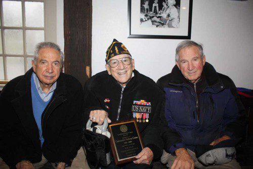WWII U.S. NAVY veteran Tony Grasso, 89, (center), past Commander of the Lynnfield American Legion Post 131 from 1992 to 2003, was presented a commemorative plaque in honor of his service to Post 131 at Lynnfield's Veterans' Day services. He was aboard the USS Missouri for the signing of the surrender treaty by the Japanese on Sept. 2, 1945. He is flanked by his brothers, Pat Grasso of Wakefield (left), a U.S. Army veteran who served during the occupation of Japan in 1946, and Charles Grasso of Peabody, who served during the combat period of the Korean War in 1952–53. Missing from photo is their brother Emilio. (Maureen Doherty Photo) 
