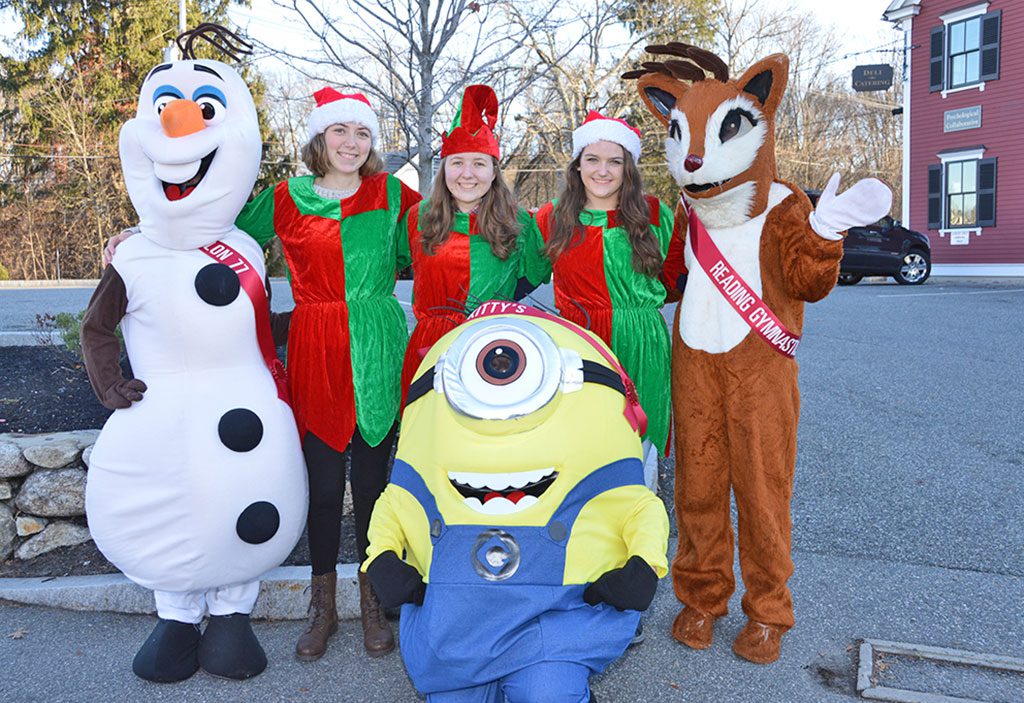 WELL–KNOWN Characters were on hand throughout the day to welcome visitors to the 10th annual Holiday Tree Lighting in North Reading Center, sponsored by the Chamber of Commerce. From left: Olaf from “Frozen”, Santa’s Helpers Gillian Audier, Emily Humphreys and Nicole Shedd, Rudolph and a Minion, (seated). (Bob Turosz Photo)