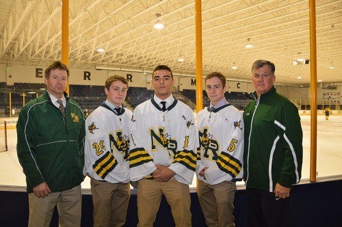 THE NRHS VARSITY HOCKEY PROGRAM is excited about playing its games this year at Merrimack College’s Lawler Rink, home of the Division I Hockey East Merrimack Warriors. From left: Head Coach John Giuliotti, Captains Patrick Driscoll, Nick Ponte and Michael Driscoll and Athletic Director David Johnson. (Bob Turosz Photo)