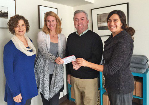 SPREADING JOY. The Melrose Emergency Fund has already topped $8,300 this holiday season thanks to the generosity of benefactors like Joy Fay of Melrose Boot Camp who present a donation recently to Mayor Rob Dolan. From left: Karen Gabler, Joy Fay, Mayor Dolan and Vanessa Roman. Gabler and Roman are Boot Camp instructors.