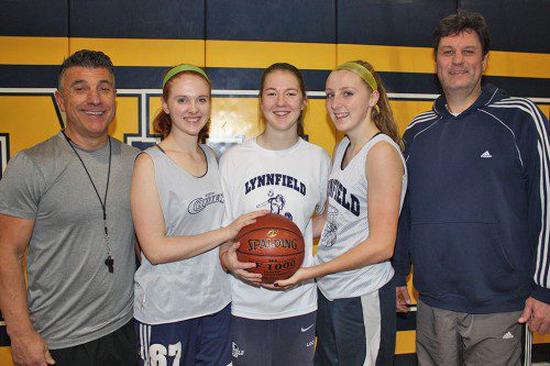 THE GIRLS’ BASKETBALL TEAM officially began a new era this week. Leading the Pioneers this season are, from left, assistant coach Peter Bocchino, senior captains Marie Norwood, Kelly Look and Abbie Weaver and head coach James Perry. (Dan Tomasello Photo)