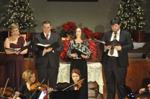 ON SUNDAY NIGHT, Standing Room Only performed an impressive holiday concert called “A Candlelight Christmas” at the Unitarian Universalist Church. Performers included singers Rachele Schmiege, Joseph Holmes, Carissa Scudieri and Will Prapestis, as well as Caroline Lieber and Ashley Offret playing violin. (Miriam Morales Photo) 
