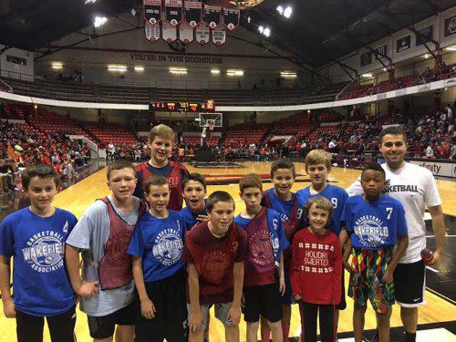THE WBA Boys' Fifth/Sixth Grade basketball team, sponsored by Dockside and its coach D.J. Cook, attended the Northeastern men’s college basketball game vs. the Harvard Crimson on Dec. 2 at Matthews Arena, nicknamed the Doghouse. Recently, Northeastern defeated 15th-ranked Miami with a buzzer beater. The WBA players played a scrimmage at halftime after the banner raising ceremony. The team got to meet Paws, the NU mascot, and have a private autograph session with the entire Northeastern team.