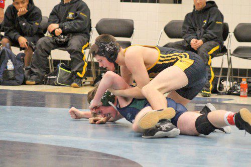 SENIOR Devin Leggett (on top) defeated his Essex Tech opponent by fall in 1:04 during the 152 lb. weight class Dec. 23. The Black and Gold defeated Essex Tech 58-22. (Courtesy Photo)