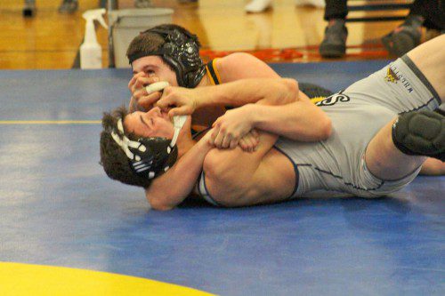 SENIOR Devin Leggett (on top) finished second in the 160 lb. weight class after compiling a 2-1 record during the Cohasset Tournament Jan. 9. Leggett has placed in all three tournaments this season. (Courtesy Photo)
