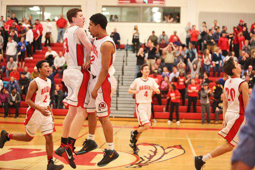 THE RED Raider hoop team had plenty of cause for celebration when they beat Wakefield last Friday, 51-47. (Donna Larsson photo) 