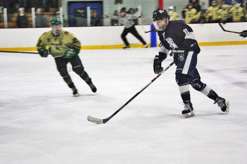 FRESHMAN Jagger Benson (11) scored a goal and had an assist during the Pioneers’ 6-2 victory over Pentucket-Georgetown Jan. 9. (Dan Tomasello Photo)