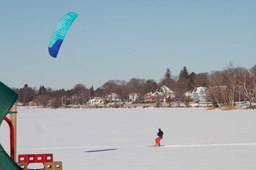 WIND conditions were just right over the weekend for taking a joy ride across the iced-over Lake Quannapowitt. (Donna Larsson Photo)