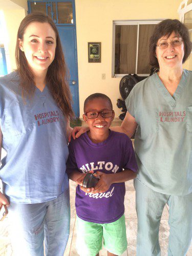 DR. VICKI KVEDAR, MD (right) and her daughter Julie, a Lynnfield High School Class of 2009 graduate, were honored to help orphans such as this child find the right pair of eyeglasses during the Kvedars third medical mission to the Be Like Brit orphanage recently. (Courtesy Photo)
