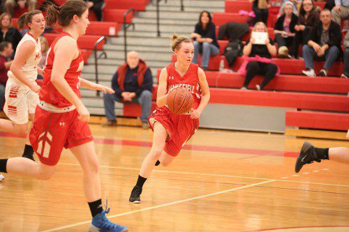 GRACE HURLEY, a senior, led the Warriors offensively with 14 points and had about half a dozen steals on defense last night at the Charbonneau Field House. The WMHS girls’ basketball team edged Burlington by a 37-35 score. (Donna Larsson File Photo)