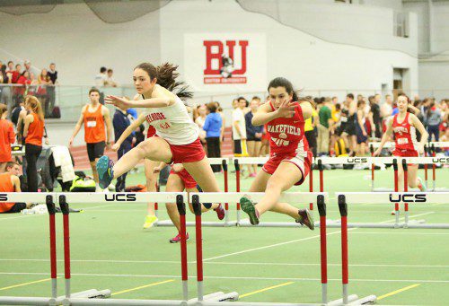 IT WAS a photo finish between Melrose’s Haley Moss (left) and her Wakefield rival Sarah Buckley in the 55 meter hurdles, but Moss came out on top last week at the Middlesex League dual meet. (Donna Larsson photo)