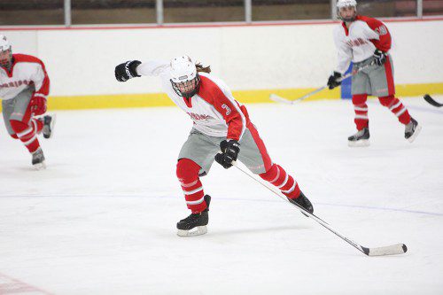 COURTNEY HILL, a sophomore defenseman (#3), skates up the ice during a recent game. Despite a valiant comeback bid last Saturday against Watertown, the Warriors came up short by a 4-3 score. (Donna Larsson File Photo)