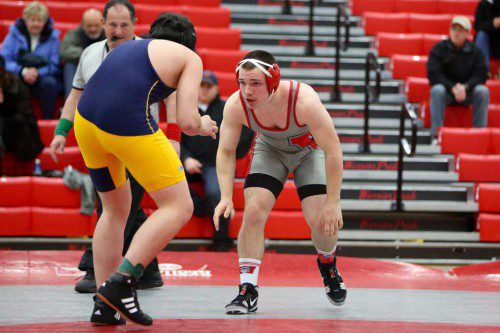 EVAN GOURVILLE, a senior captain (right), gets ready to wrestle his opponent during a recent meet. Last night against Melrose’s Jacob Harvey, Gourville won by technical fall at the 170 weight class. (Donna Larsson File Photo)