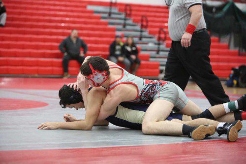 BEN PIERCY, a junior (right), posted three wins in Wakefield’s quad-meet against Wilmington, Saugus, and Pentucket on Saturday at the Charbonneau Field House. The Warriors won all three matches to go to 12-5-0 on the season. (Donna Larsson File Photo)