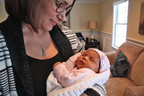 MOMMY AND ME TIME. Rebecca Eatman cuddles her newborn daughter, Jada Rae, the winner of this year's First Baby of the New Year contest. (Maureen Doherty Photo)