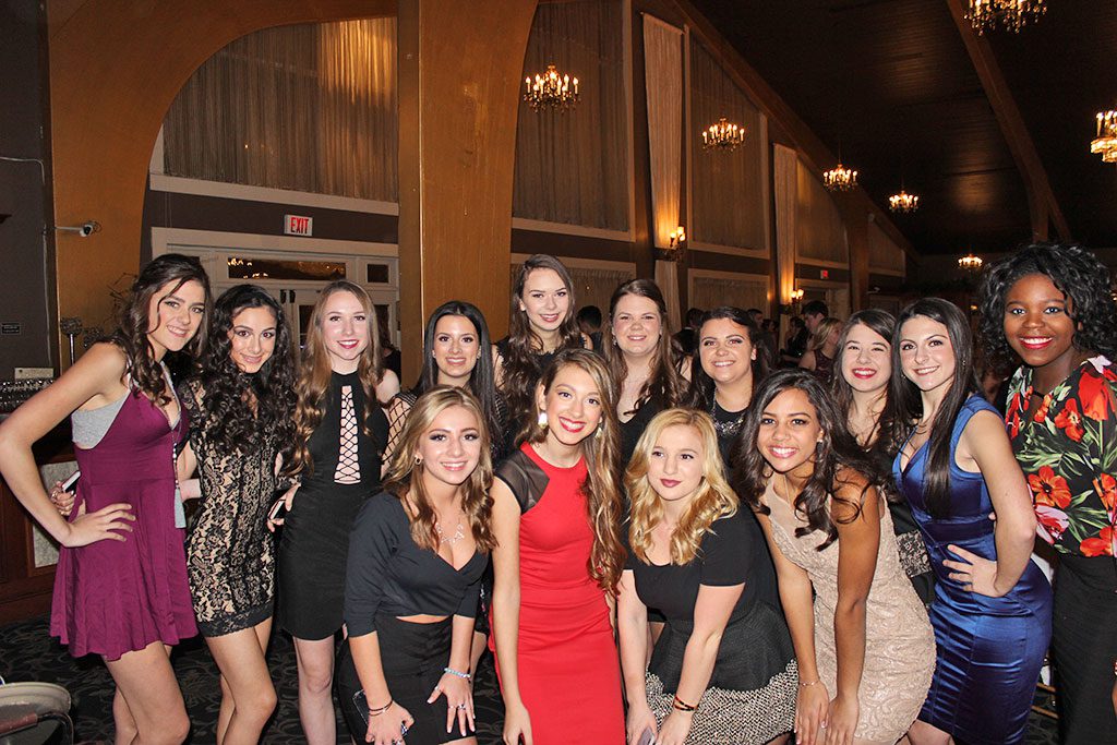 FOUR HUNDRED high school students attended the annual Snowball dance at the Danversport Yacht Club recently. Front row, from left, Crystal Shaffer, Lily Keene, Elise Murphy and Jaylin Grabau. Back row, from left, Shannon Furey, Julia Kerr, Bella Herook, Jillian Zahar, Jessica DiGangi, Abbie Dickey, Rachel Strout, Danielle Douglas, Leigh Guerra and Nnenne Nwangwu. (Ally Peters Photo)