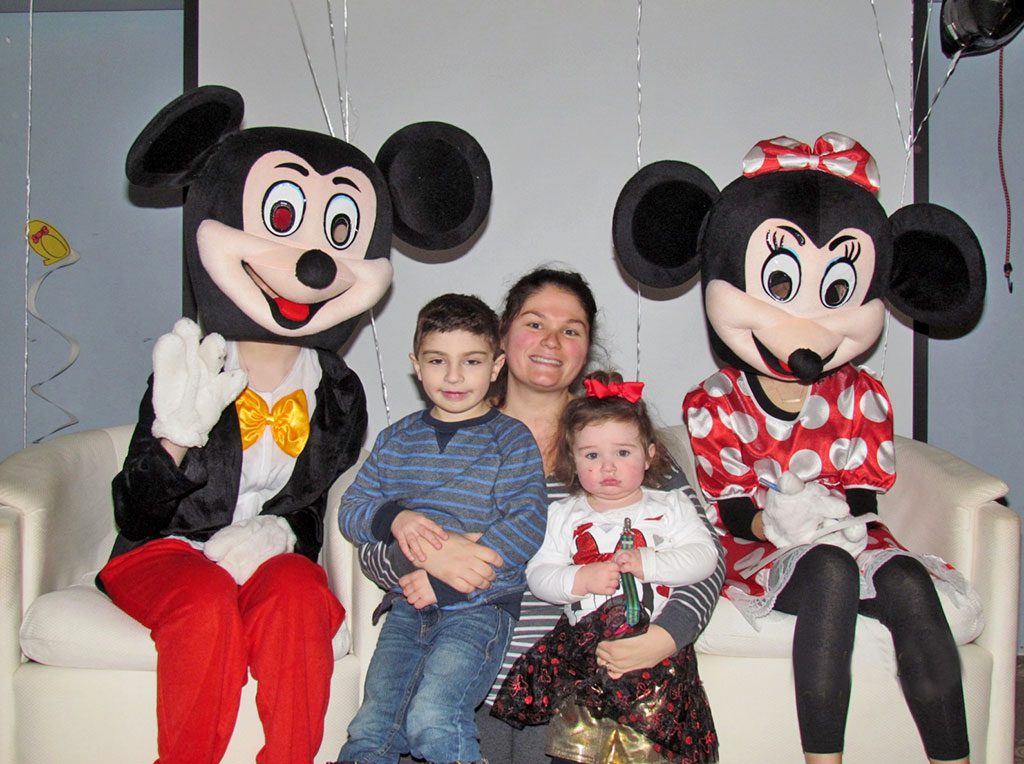 MICKEY MOUSE (Shelby Downer, NRHS student), Minnie Mouse (Maddy Knight, NRHS student), with mom Sabrina Coviello and her son Adam and daughter Olivia, who were among the 350 people at the second annual Disney Character Breakfast sponsored by Parks and Recreation. (Courtesy Photo)