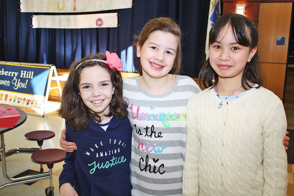 CLOSE FRIENDS, from left, Ava Remon, Isabelle Moschella and Emma Tran worked diligently to make sure first responders, teachers, school officials and custodians had plenty to eat during Huckleberry Hill School's second annual Heroes Breakfast Feb. 12. (Dan Tomasello Photo)