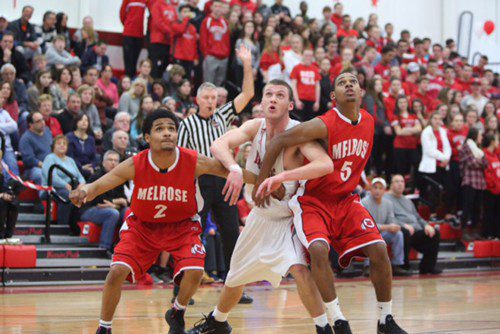 THE FORECAST for a tournament appearance looks good for the 9-8 Red Raider hoop team, who split league play this week. (Donna Larsson photo)