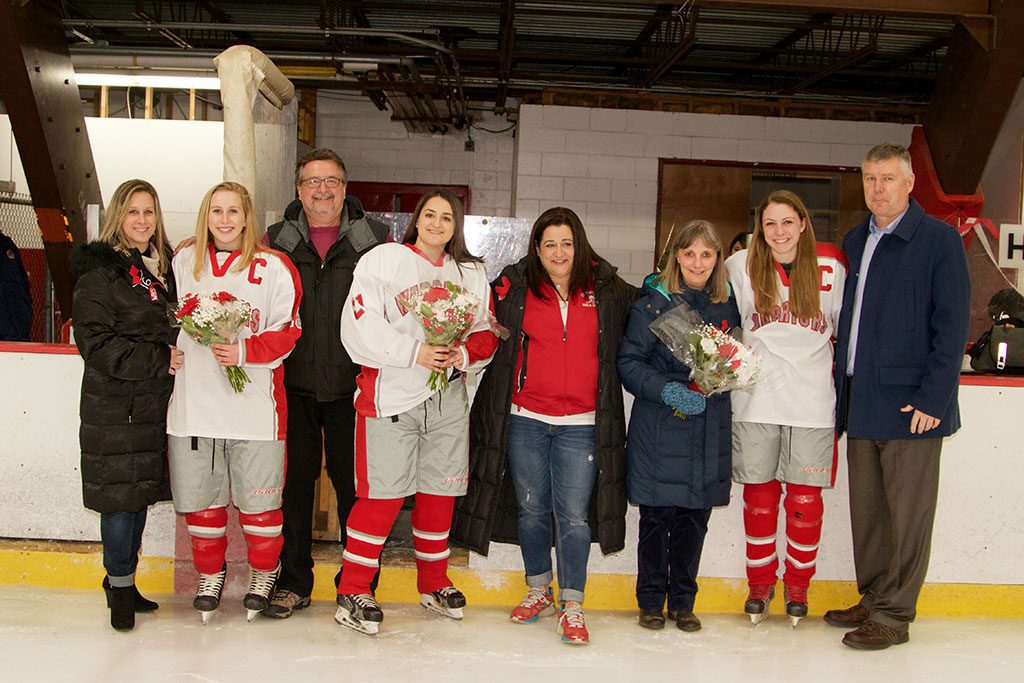 THE WMHS girls’ hockey seniors were honored on Senior Night last evening at the Kasabuski Arena. Pictured with their parents are Meaghan Kerrigan, Gabrielle Nadolny and Julianne Bourque. (Donna Larsson Photo)