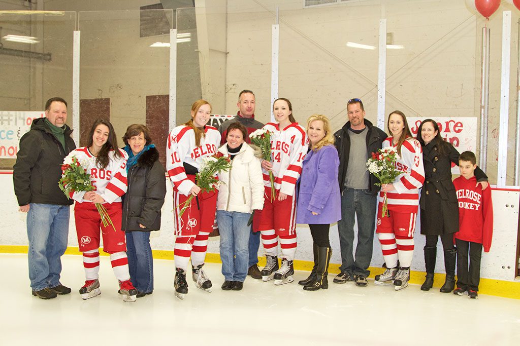 HELPING CELEBRATE Senior Night for the Lady Raider hockey team were their seniors and families. Even better was a win that day to qualify for post season. Pictured: Peter and Cheryl Henry (Michelle Henry), Ann Perry (Katy Perry) Lisa & Sean Gorman (Alyssa Gorman) and Jeff and Shawna Kendall (Kellianne Kendall).