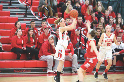 SENIOR GUARD Grace Hurley (#15) scored a game high 24 points including five three-pointers against Burlington in Wakefield’s 50-41 triumph. The Warriors are now one win away from clinching a state tournament berth. (Donna Larsson File Photo)