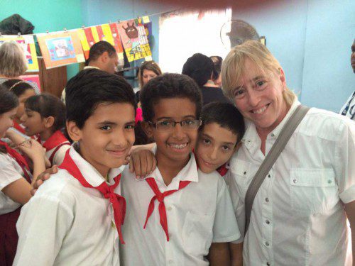 SCHOOL SUPERINTENDENT Dr. Kim Smith got to meet some fifth grade boys during her recent trip to Cuba. Smith traveled to the island nation with a delegation of American educational leaders over February school vacation. (Courtesy Photo)
