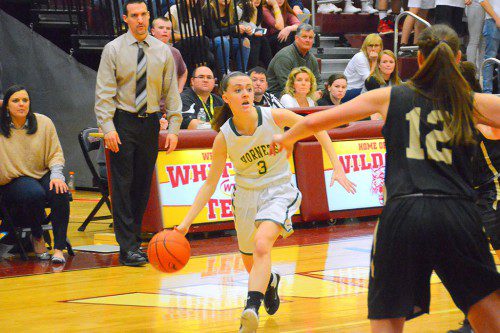 SENIOR JULIA MCDONALD, who played a great game against Bishop Fenwick, looks to pass the ball on her way to the hoop. (John Friberg Photo)