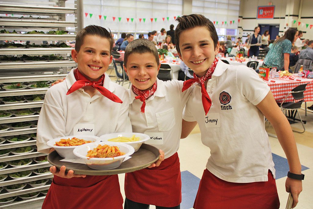 SUMMER STREET fourth graders, from left, Anthony Graveau, Christian Rosa and Jimmy Driscoll were servers during the Summer Street School PTO’s second annual Pasta Palooza family dinner at Lynnfield High School March 30. (Dan Tomasello Photo)