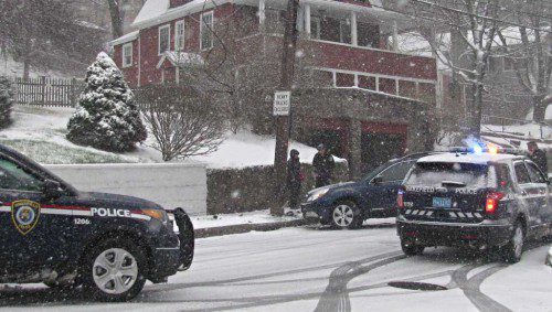 ICY ROAD CONDITIONS caused this 2010 Subaru Outback to skid into a pole as the driver attempted to stop at the “Stop” sign at the bottom of Green Street. (Mark Sardella Photo)