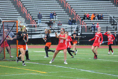 ISA CUSACK (#30), a senior captain, returns to lead the Warrior defense this spring. The girls’ lacrosse team posted an 11-win season and clinched a state tournament berth a year go. Wakefield hopes to have even more success this spring. (Donna Larsson File Photo)