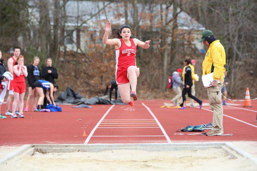 CHRISTINA FRENI, a junior, competed in both the long jump and 100 meter hurdles at the Nashua North Invitational Meet. Freni came in eighth overall in the hurdles with a personal best time of 18.87 seconds. (Donna Larsson File Photo)
