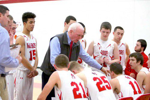 BOYS’ BASKETBALL Head Coach Brad Simpson instructs his team during a game this past season. Simpson was one of the recipients of the 2015-16 MIAA Coach of the Year Award. (Donna Larsson File Photo)