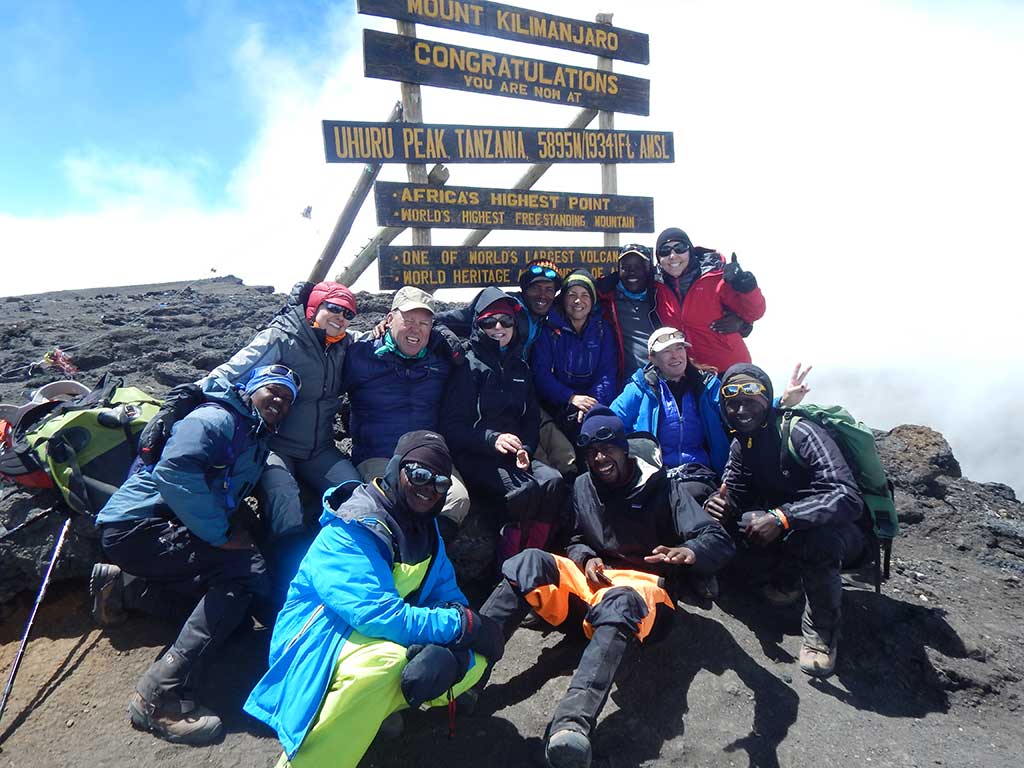 FORMER Lynnfield resident Bob Hand (back row, third from left) and a group of trekkers made it to the summit of Mt. Kilimanjaro in February. The mountain is the highest on the African continent and the largest free-standing mountain in the world. (Courtesy Photo)