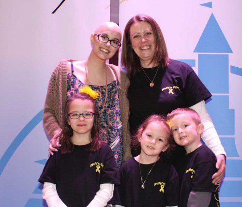 MOLLY MALONE, 15, shown with her mom, Nukhet, and her sisters and brother, Emily, 7, and twins Patrick and Audrey, 6, is battling Ewing sarcoma. Tickets are available at the door to the benefit concert for the family featuring children’s performer Ben Rudnick and Friends on Saturday at Burlington High School. (Maureen Doherty Photo)