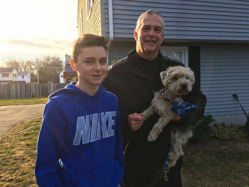 AYDEN FORNI (left) returned Reading resident Michael Creamer’s missing dog Cody this week after the dog was found in North Reading. (Courtesy Photo) 